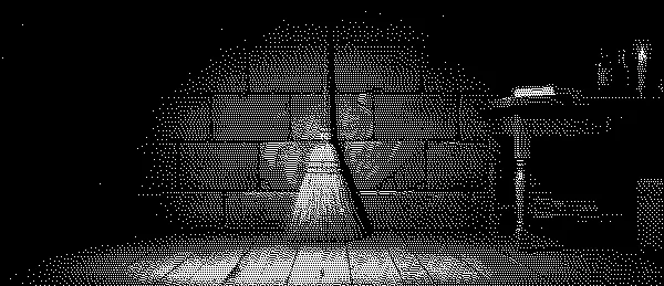 A broom leaning against the wall